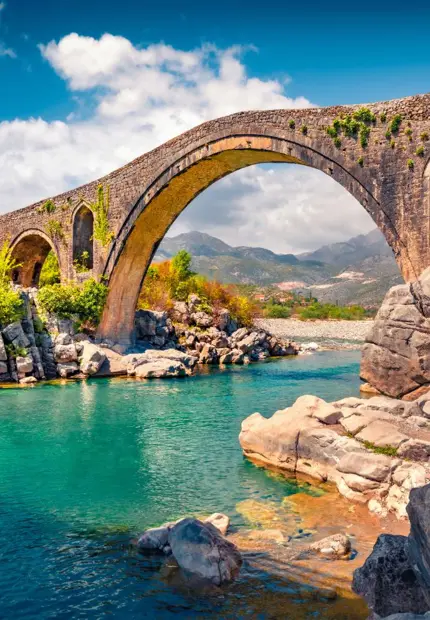 Historic stone arches of Mesi Bridge above the Kir River