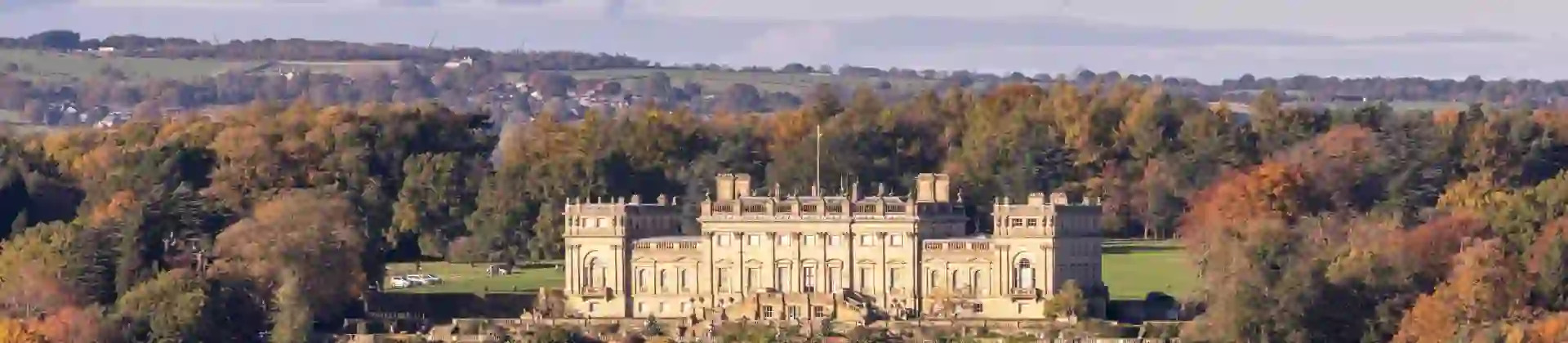 Harewood House, a grand stately home set among autumnal trees and rolling Yorkshire countryside