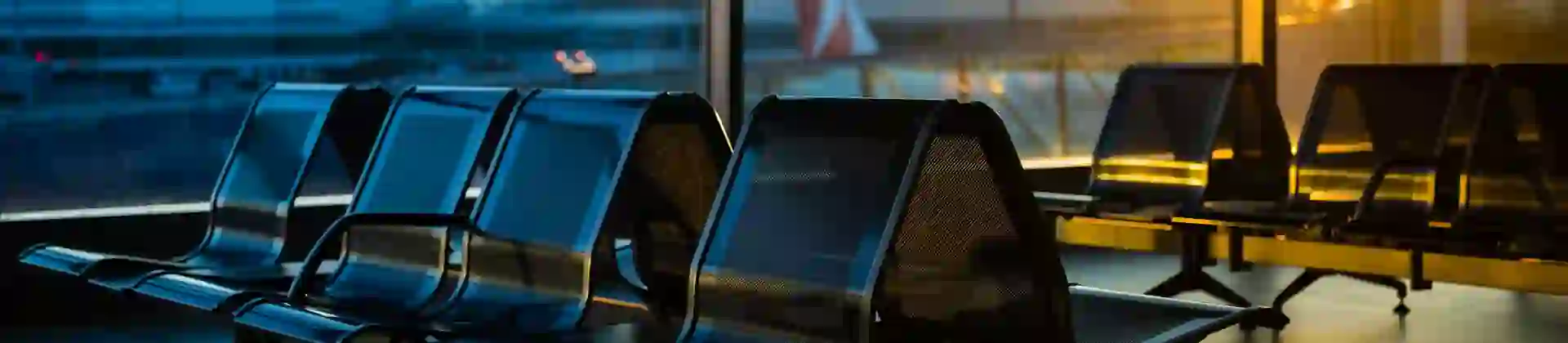 Empty seats at a boarding gate in an airport