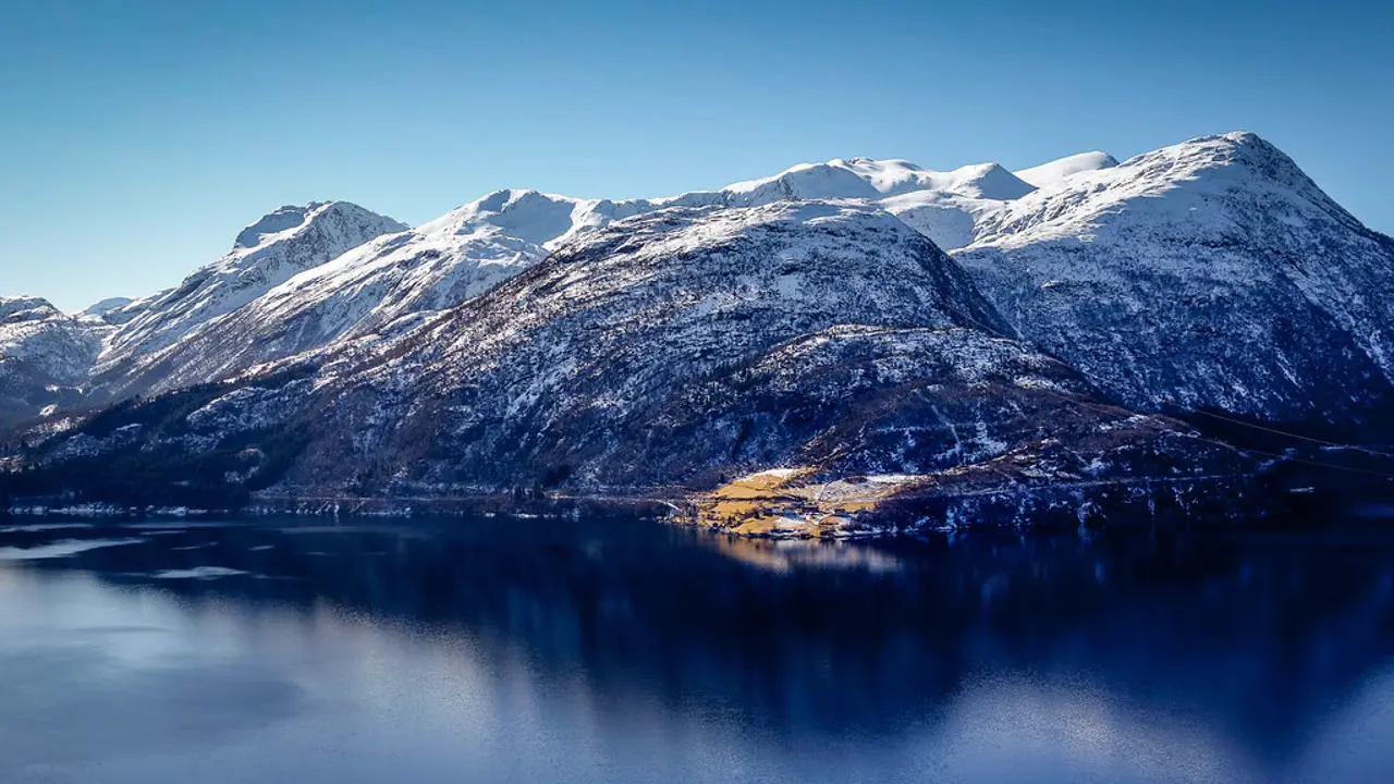 Snowy landscape and waters of Austefjorden, Norway