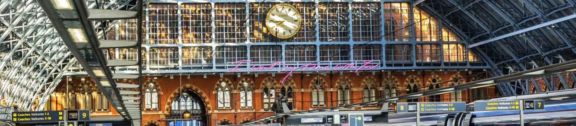 The Eurostar platforms at St Pancras International station in London, featuring the station’s iconic arched glass roof in the background
