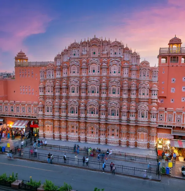 The Hawa Mahal, or Palace of the Winds, in Jaipur’s Pink City, displaying its striking honeycomb façade with hundreds of intricately carved windows at sunset