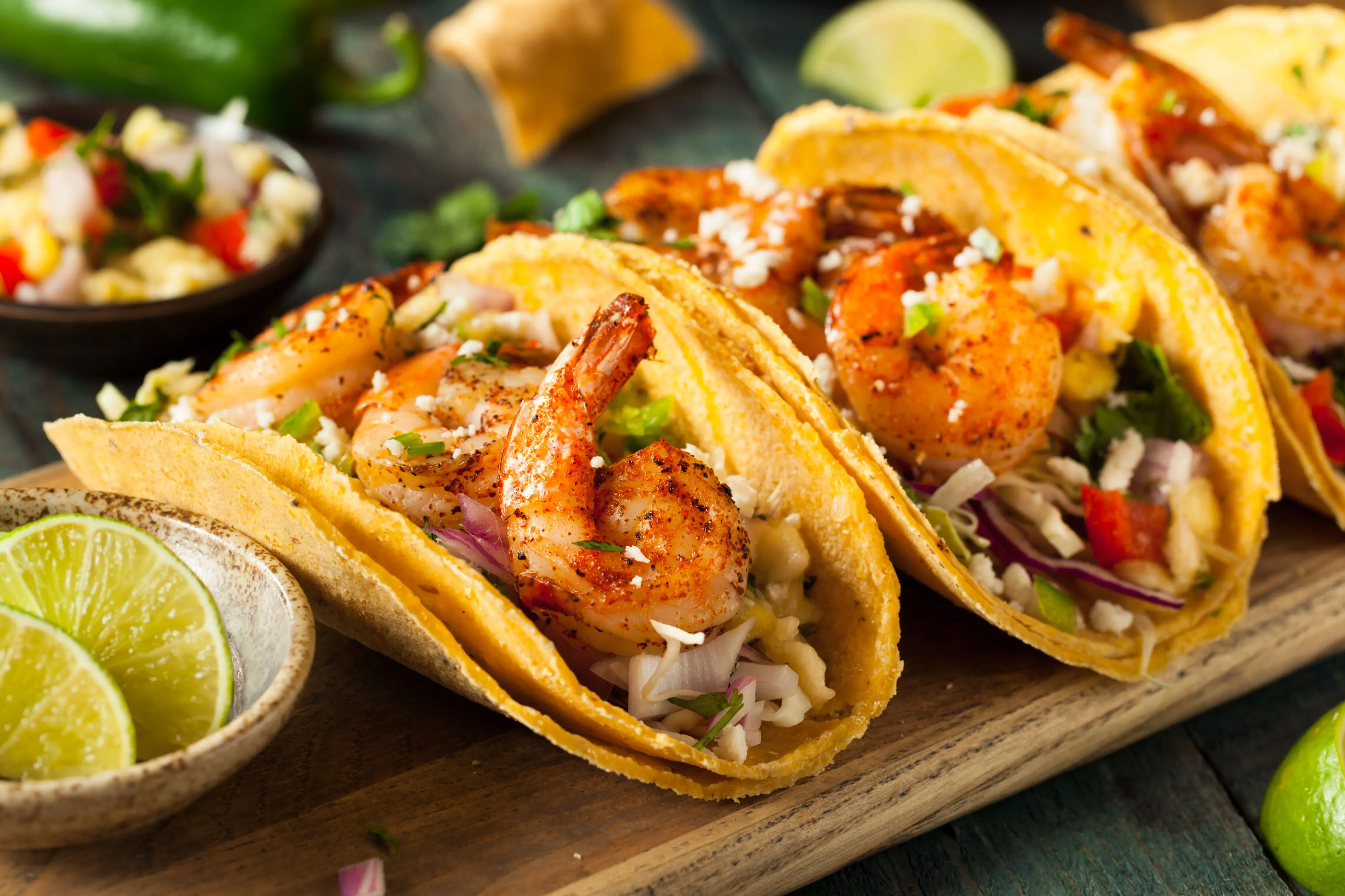 Homemade spicy shrimp tacos with coleslaw and salsa