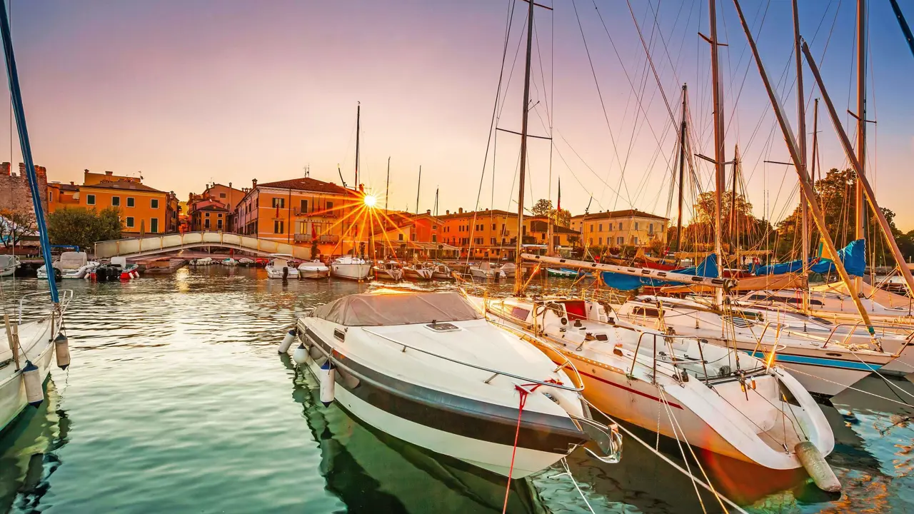 Bardolino Harbour, Lake Garda, Italy, with boats on the water 