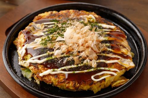 Chef preparing sushi with chopsticks