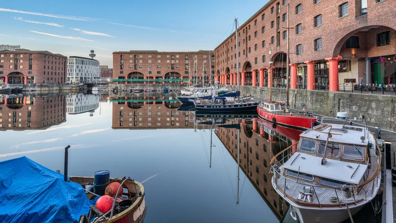 The Royal Albert Dock, Liverpool on a sunny day with boats in the harbour