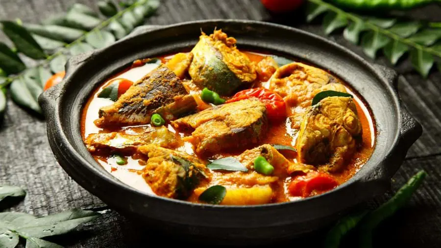 Traditional coconut milk mango fish curry, India