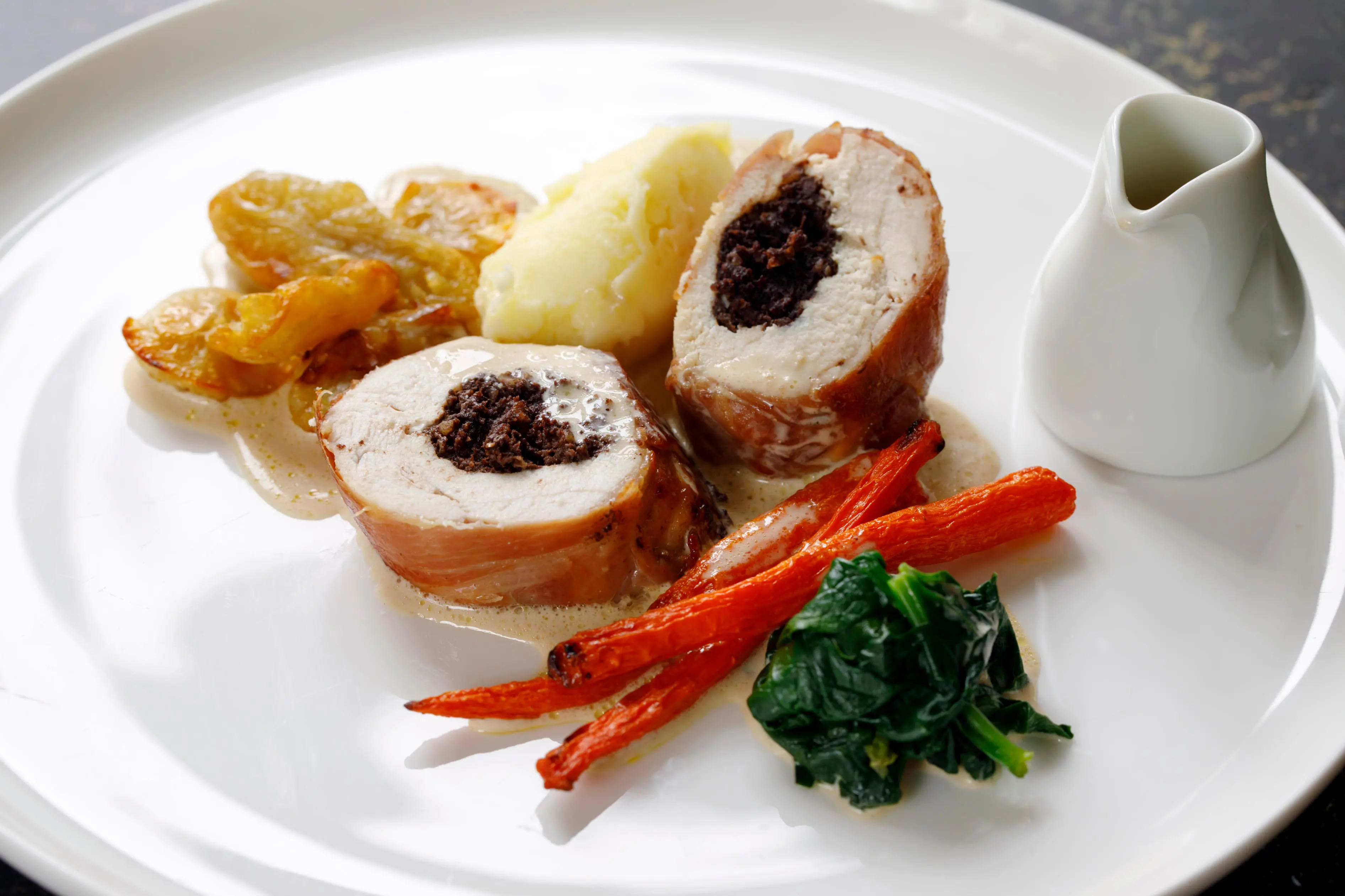 Chicken balmoral stuffed with black pudding, carrots, spinach and jerusalem artichokes