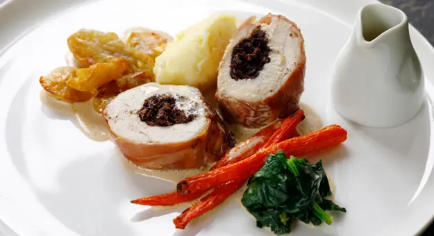 Chicken balmoral stuffed with black pudding, carrots, spinach and jerusalem artichokes