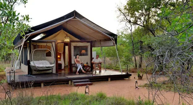 Safari Plains couple sitting outside their tent