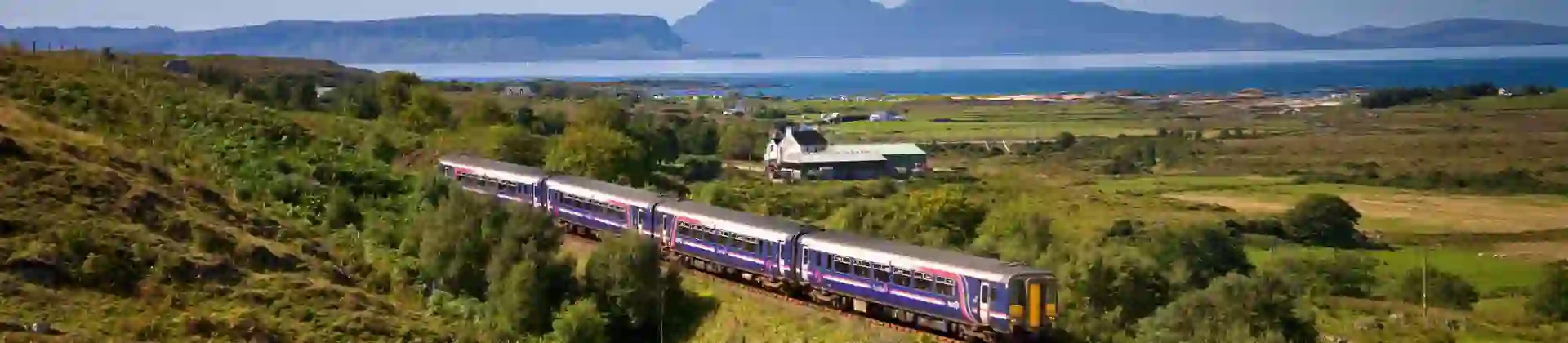 A Sprinter Mallaig Line train going along the railway in the Scottish Highlands