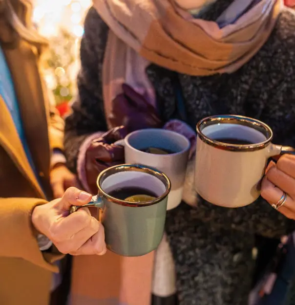 Friends with mulled wine at Christmas