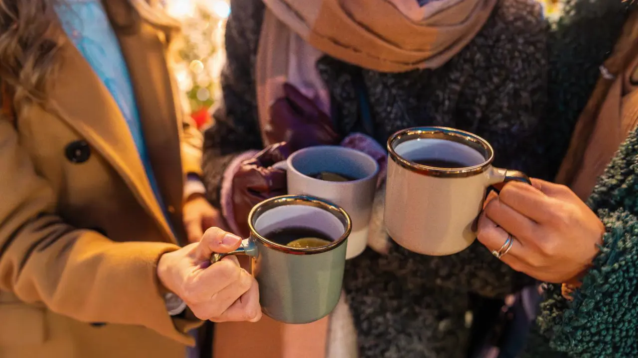 Friends with mulled wine at Christmas