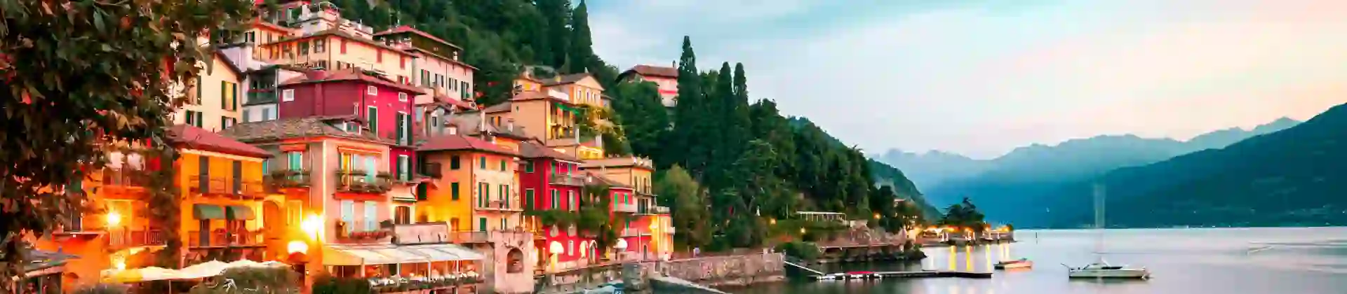 Buildings of Lake Como and the body of water at sunset
