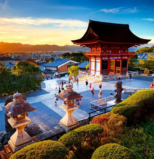 Kiyomizu-dera Temple in Kyoto perched on a hillside, with wooden terraces overlooking colourful autumn foliage