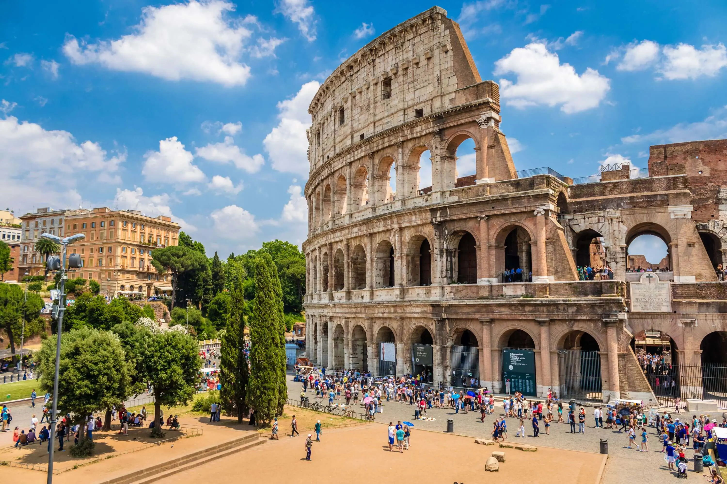 Shot of half the Colosseum and half some of the town in Rome