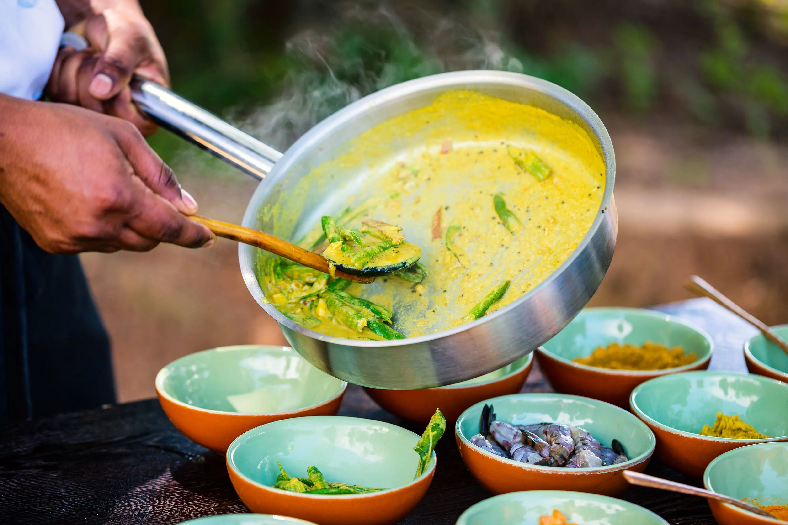 Chef preparing traditional Sri Lankan curry