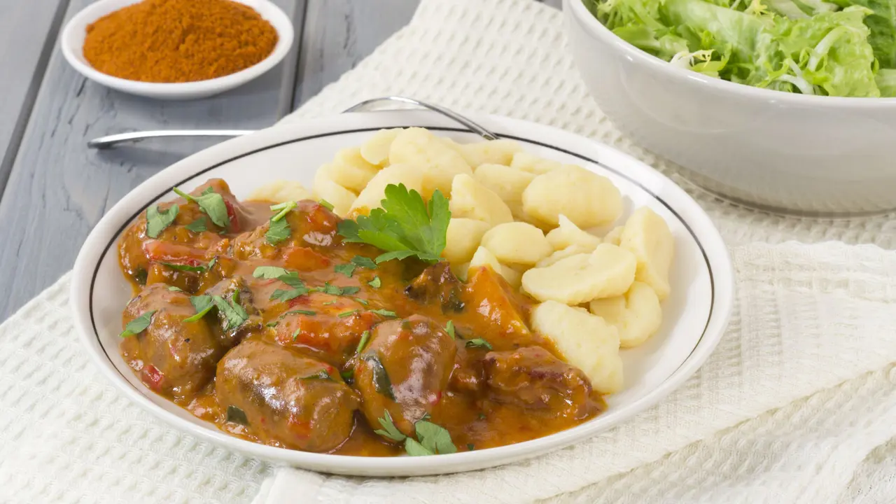 Plate of Pörkölt, a beef an onion stew, with nokedli (dumplings)