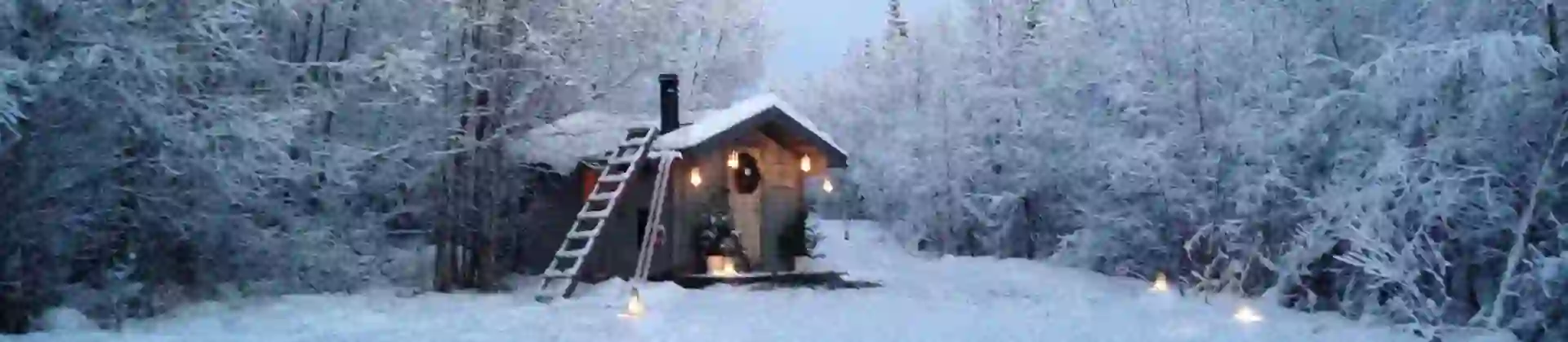 A cabin in the snowy woods in Pajala, Lapland