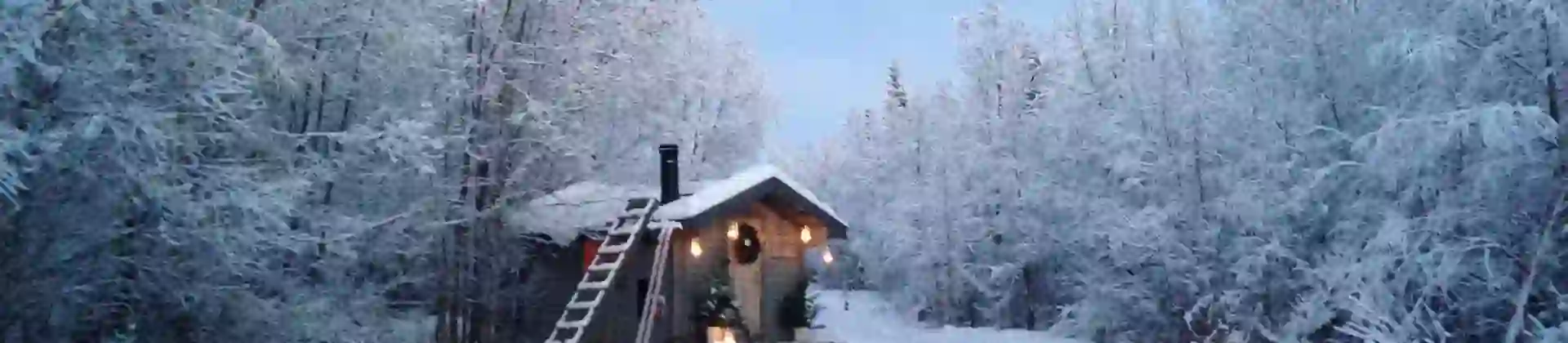 A cabin in the snowy woods in Pajala, Lapland