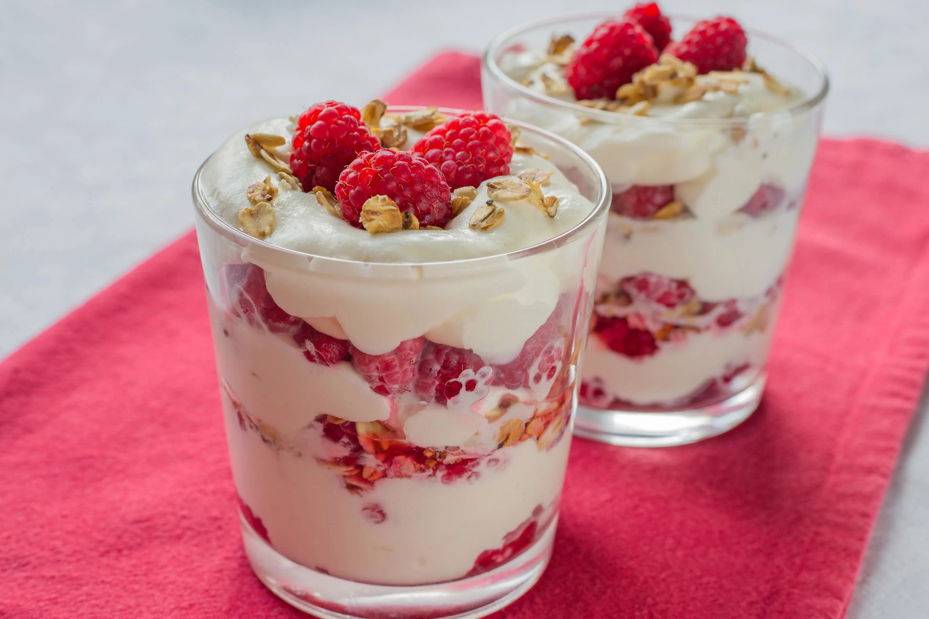 Cranachan - traditional Scottish dessert with raspberry, whipped cream, roasted oatmeal and whisky