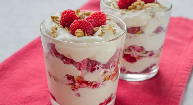 Cranachan - traditional Scottish dessert with raspberry, whipped cream, roasted oatmeal and whisky