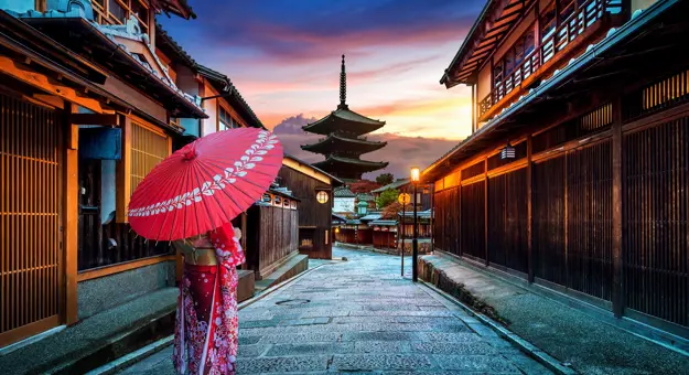 Woman Walking in Higashiyama district in the Old Town of Kyoto, Japan.