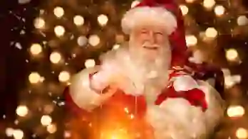 Santa holding a lantern and smiling, with a background of fairy lights