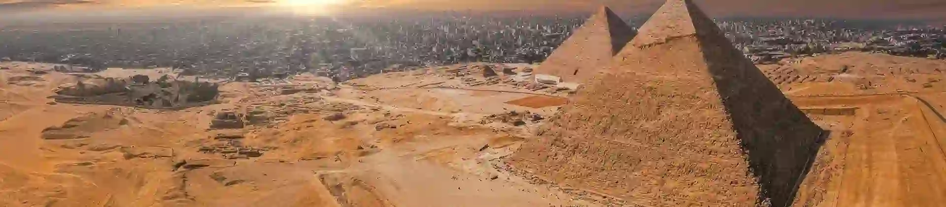 Magical sunset over the Egyptian pyramids. Aerial view of the Pyramids of Giza in Egypt.