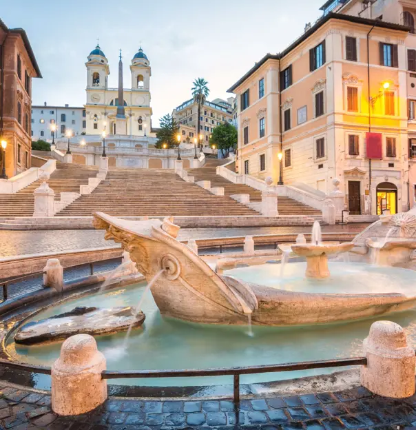 Shot of the Spanish Steps, with  Fontana della Barcaccia in the forefront 
