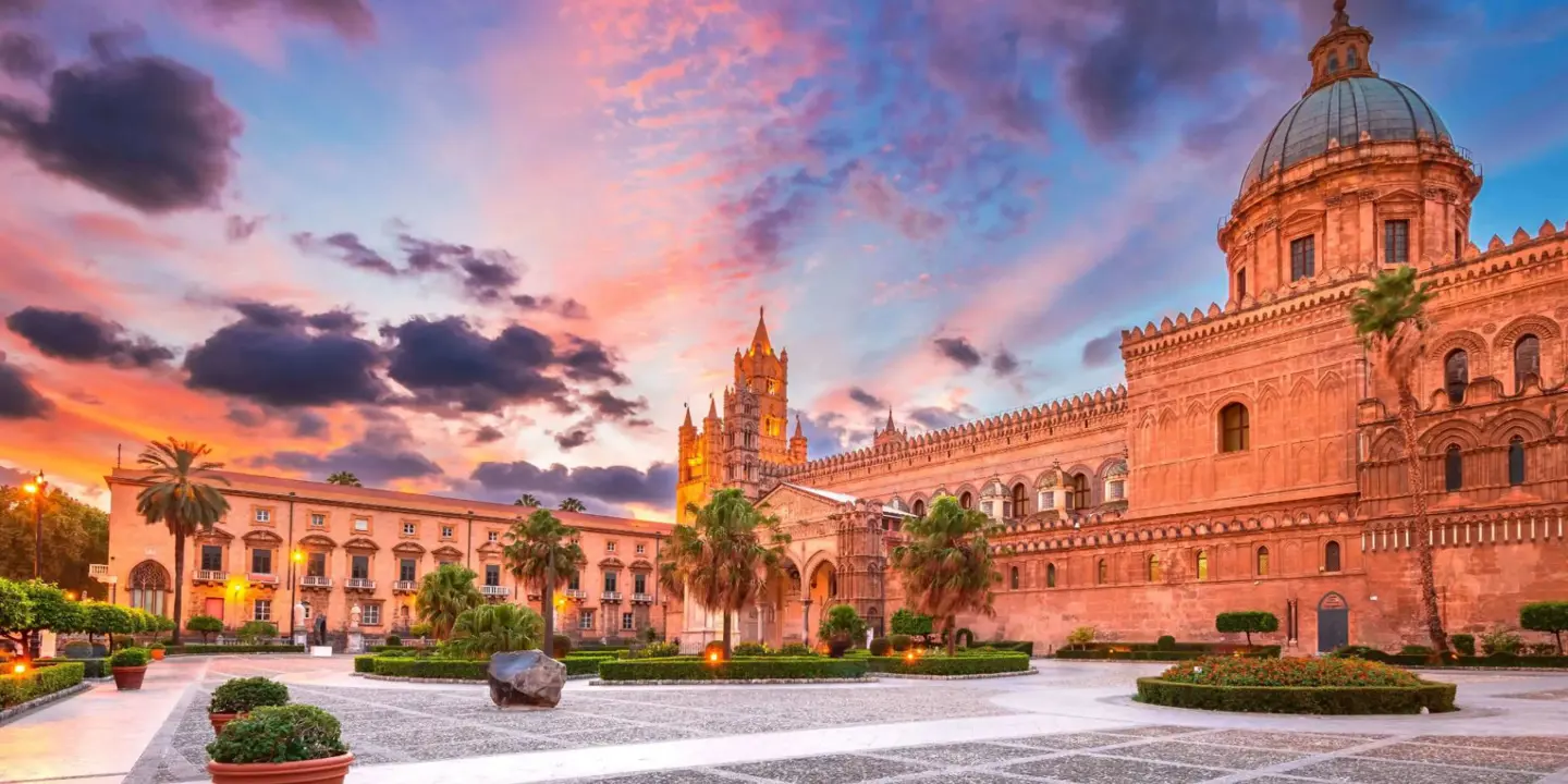 Palermo Cathedral at sunset, with warm light highlighting its historic architecture