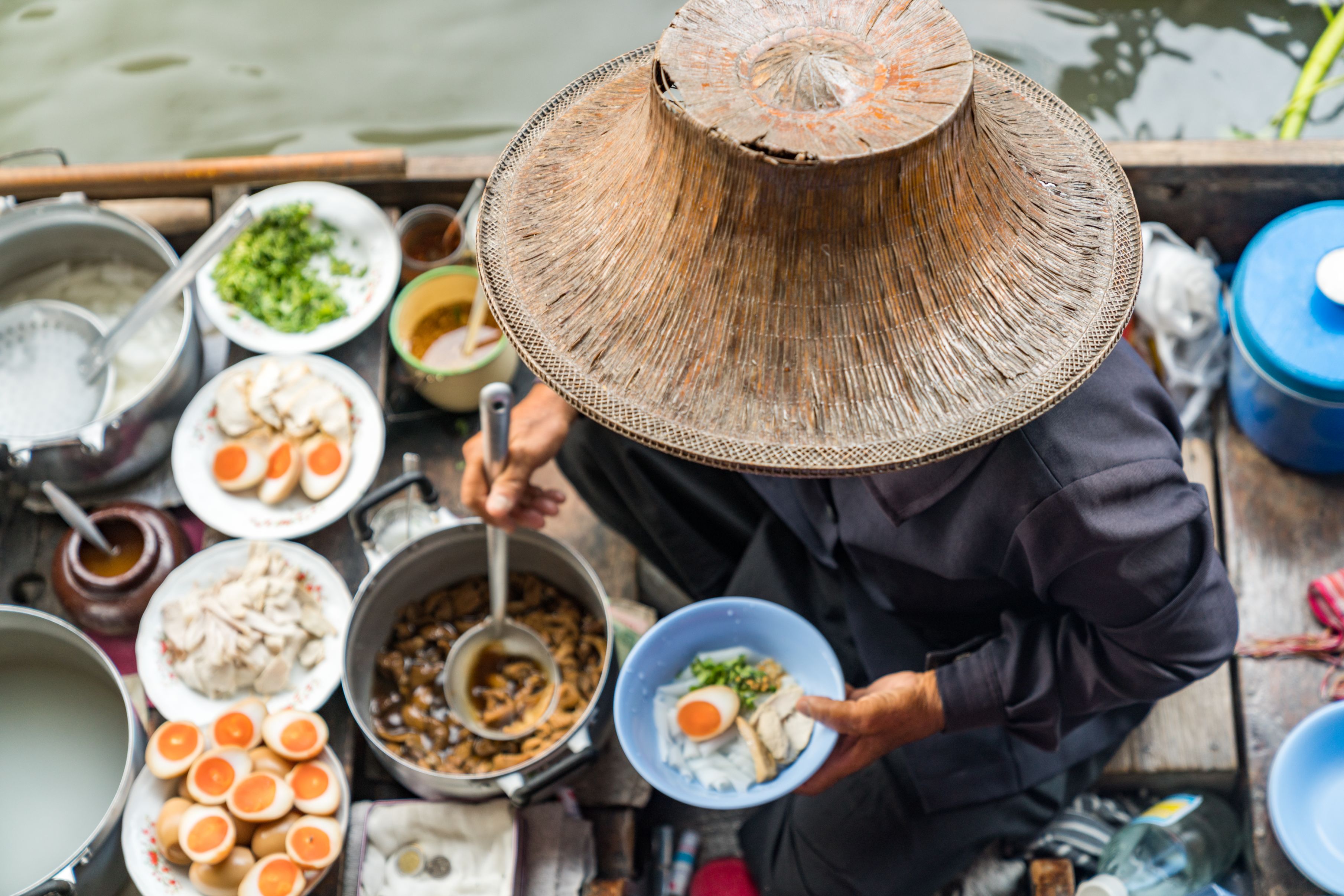 Image of person preparing Thai Food on Floating Market
