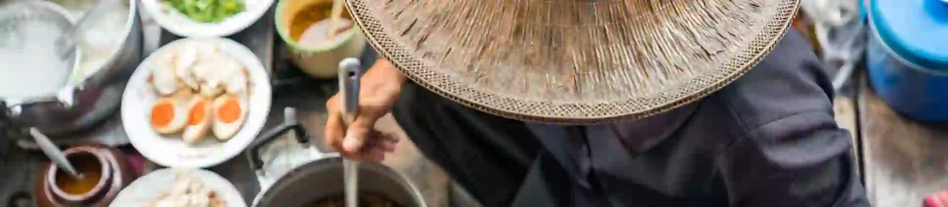 Image of person preparing Thai Food on Floating Market