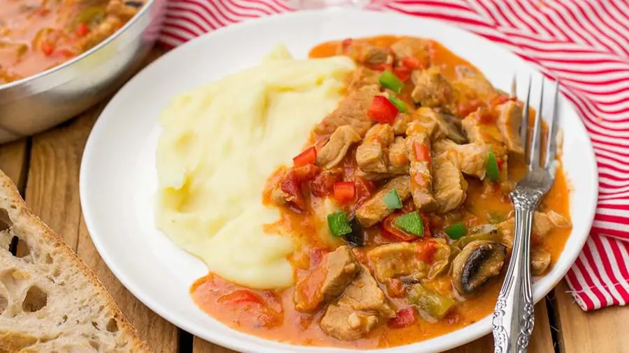 Plate of pörkölt with mashed potato
