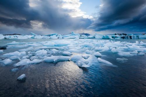 Icy terrain stretching across a flat landscape in Iceland