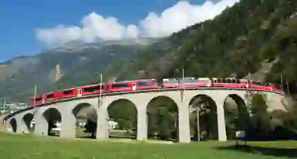 The Bernina Express going across Brusio Spiral Viaduct, Switzerland