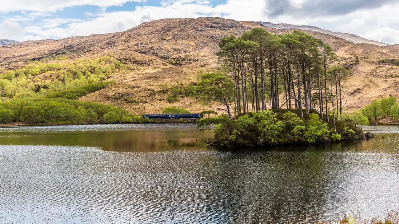 Train passing Loch Eilt, Lochaber, West Highlands, Scotland
