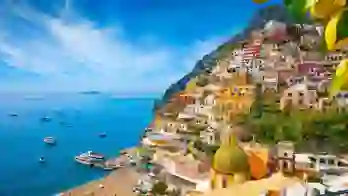 Colourful cliffside village of Positano on the Amalfi Coast, Italy, with pastel-coloured houses cascading down steep hills towards the sparkling blue Mediterranean Sea