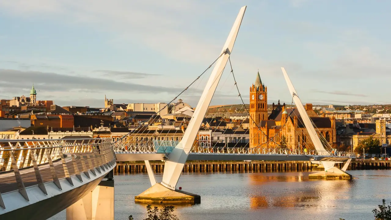 The Peace Bridge over River Foyle and Guildhall, Derry City