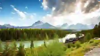 A train travelling through the Canadian Rockies, with rugged mountains in the background and dense evergreen forests lining the tracks