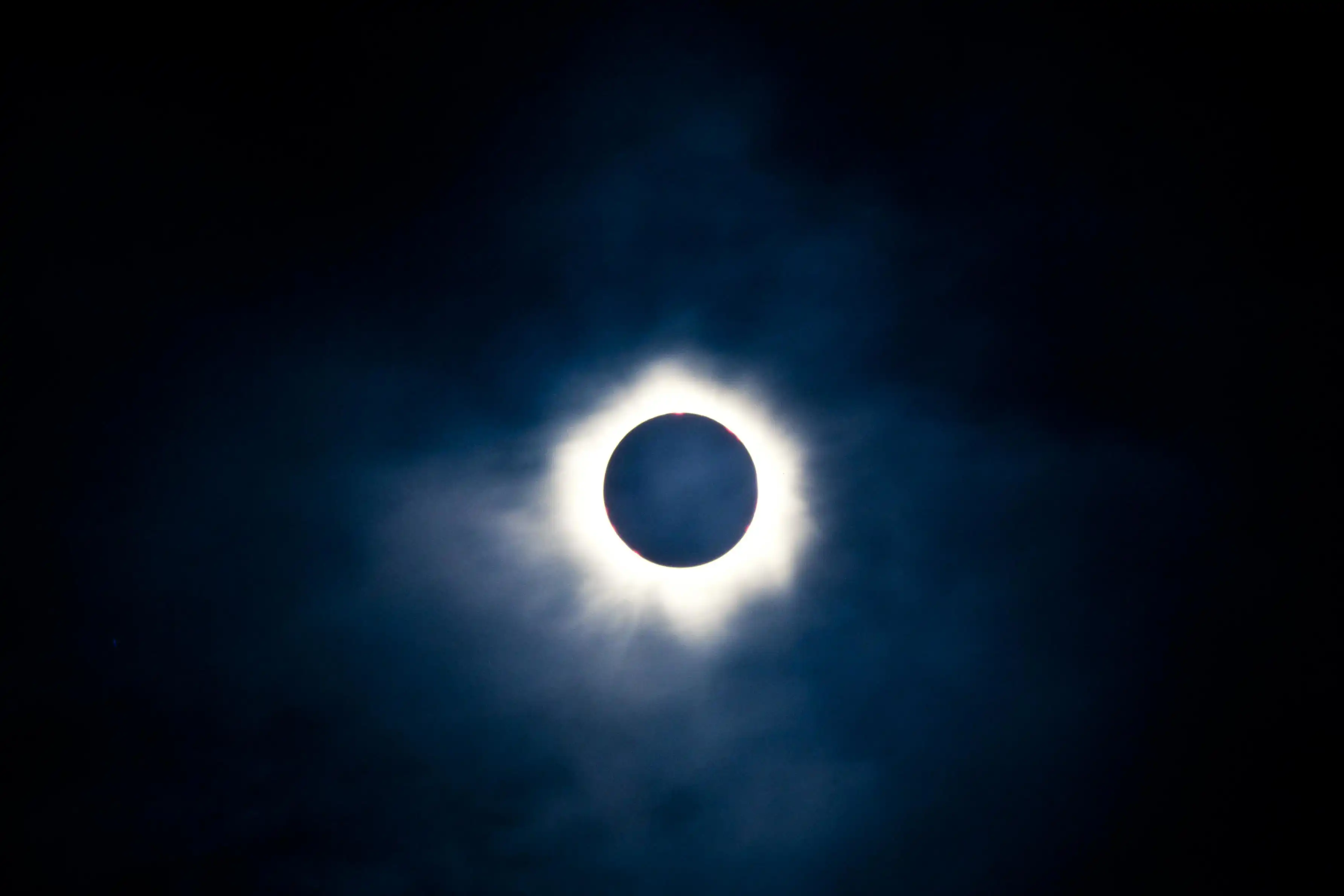 Total solar eclipse with the moon obscuring the disc of the sun so that only the corona is visible as a bright ring